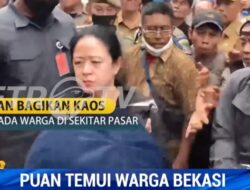 Cemberut Saat Bagi-bagi Kaos, Bahasa Tubuh Puan Maharani Sulit Menyatu dengan Rakyat