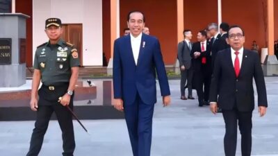Alien Mus: Dasi Kuning Jokowi, Kode Dukungan Untuk Kemenangan Partai Golkar